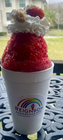 Strawberry shaved ice topped with whipped cream